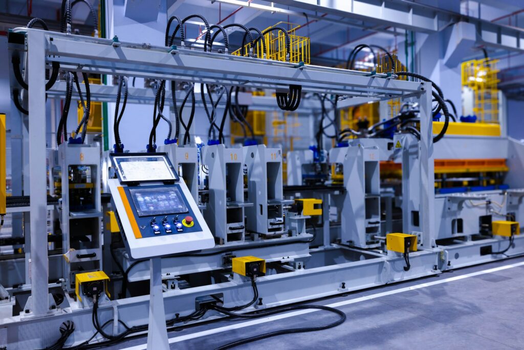 Automated manufacturing system with control panel and production equipment