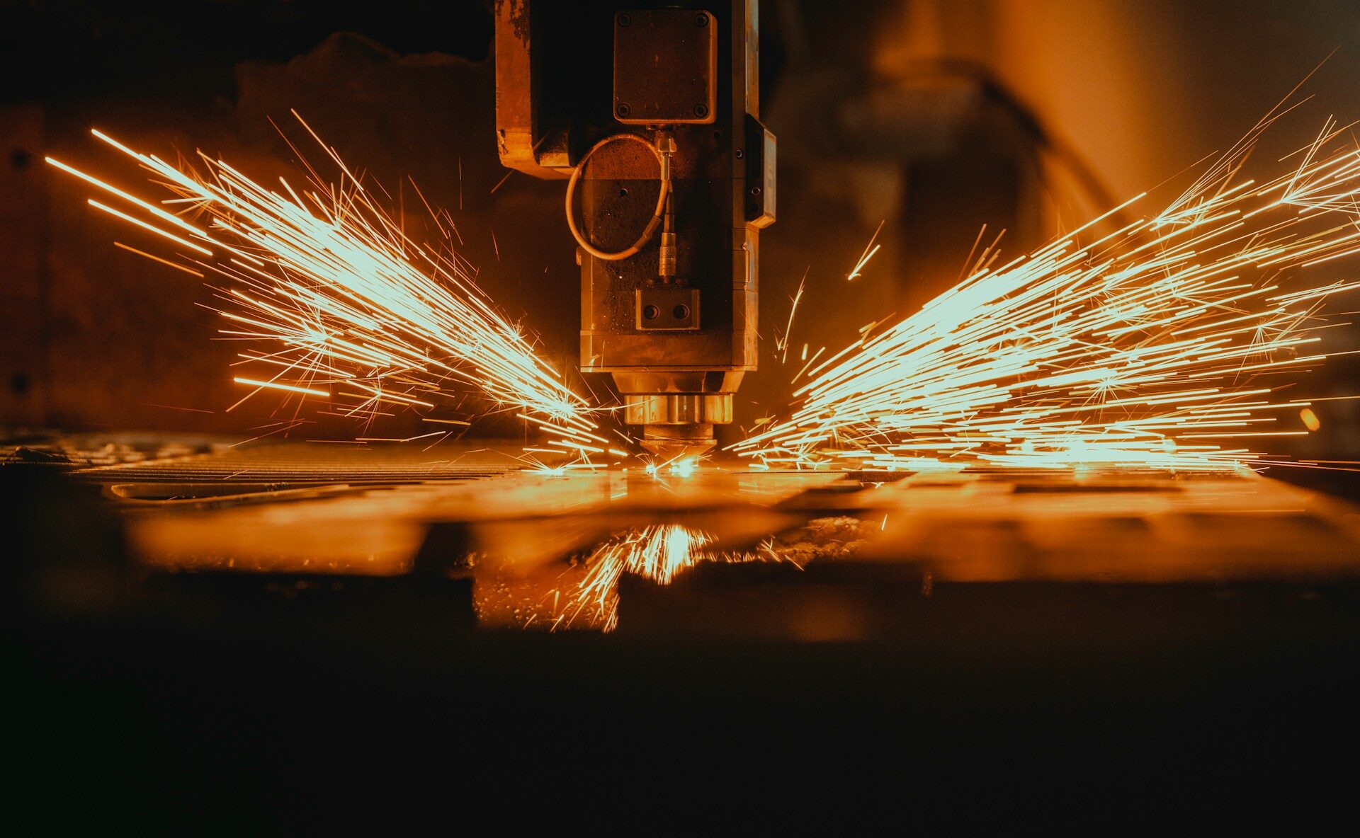 Laser cutting machine with sparks in manufacturing