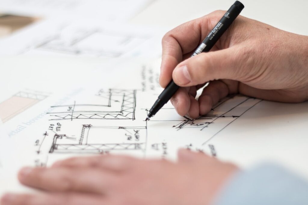 Engineer sketching process improvement and product design plans